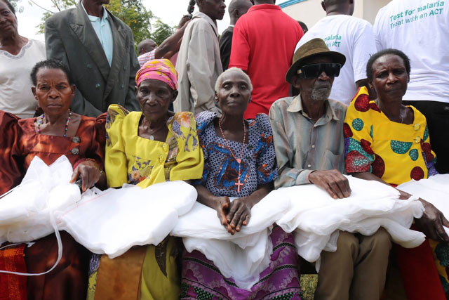 Close-up comparison of different mosquito net types available in Uganda: rectangular, round (cone), pop-up, and ceiling-mounted retractable nets.